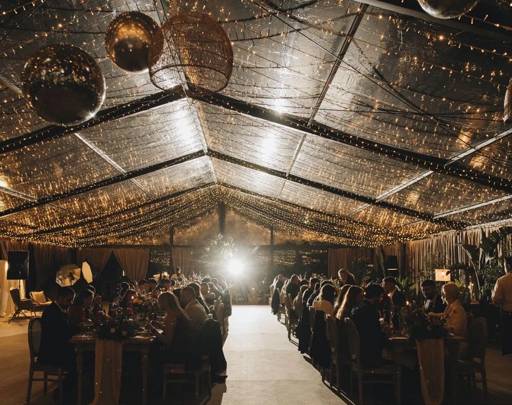 Evening wedding celebration inside D'Orangerie